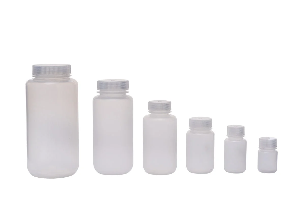 Various types of laboratory reagent bottles for chemical storage.