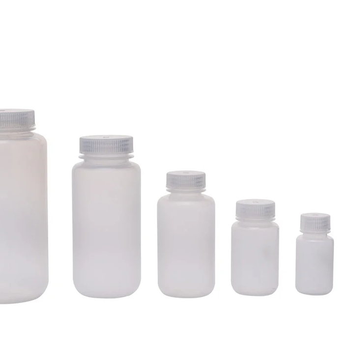 Various types of laboratory reagent bottles for chemical storage.