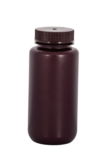 Brown plastic bottle with a lid on a white background
