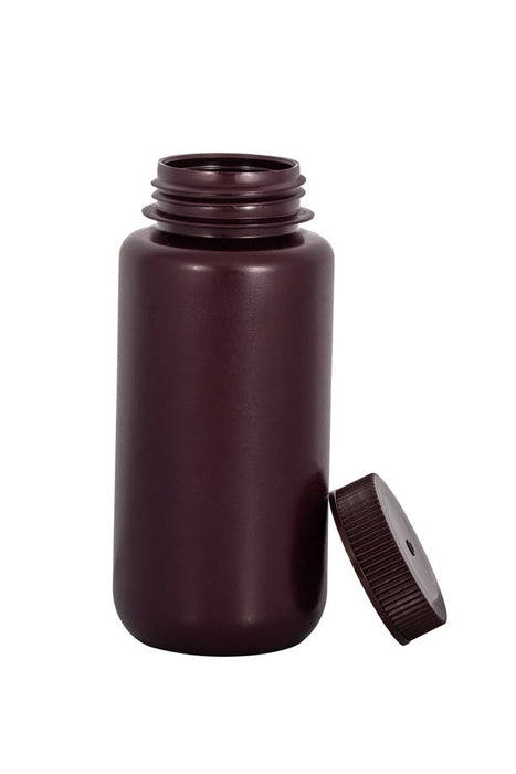Brown plastic bottle with cap on a white background