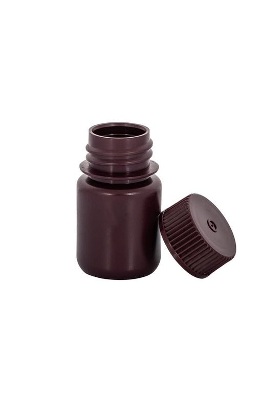 Brown glass dropper bottle with cap on a white background