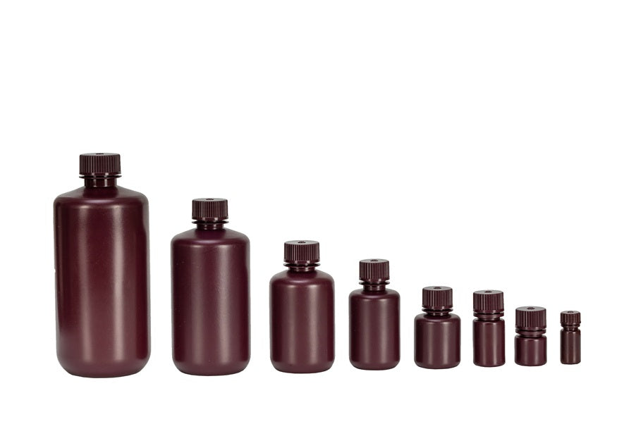 Set of brown bottles of varying sizes on a white background