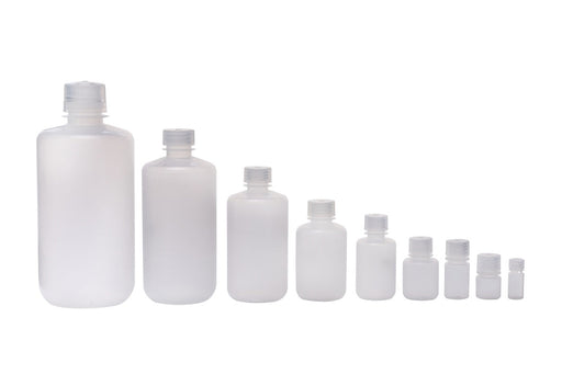 Set of white plastic bottles of various sizes on a white background